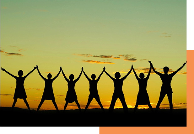 A group of people holding hands in the air.