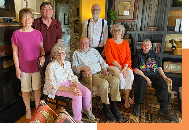 A group of people sitting on top of a couch.